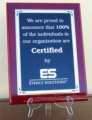 Plaque stating one hundred percent of an oranization are Certified by Ethics Solutions